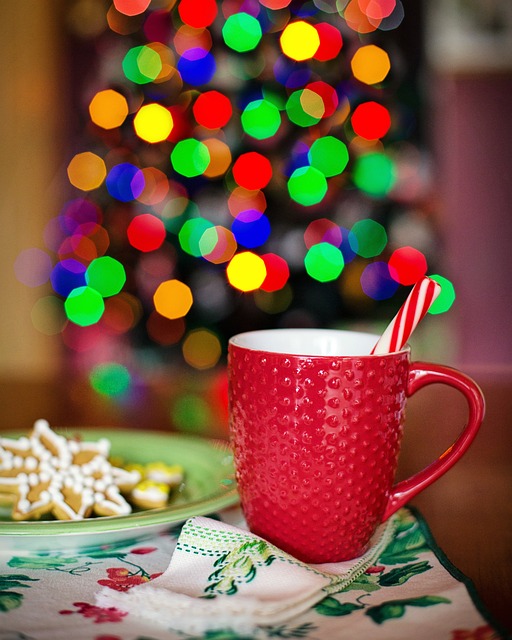 festive cup of hot chocolate in front of twinkly lights